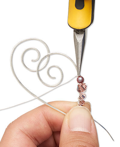 Pliers adding beads to shaped wire